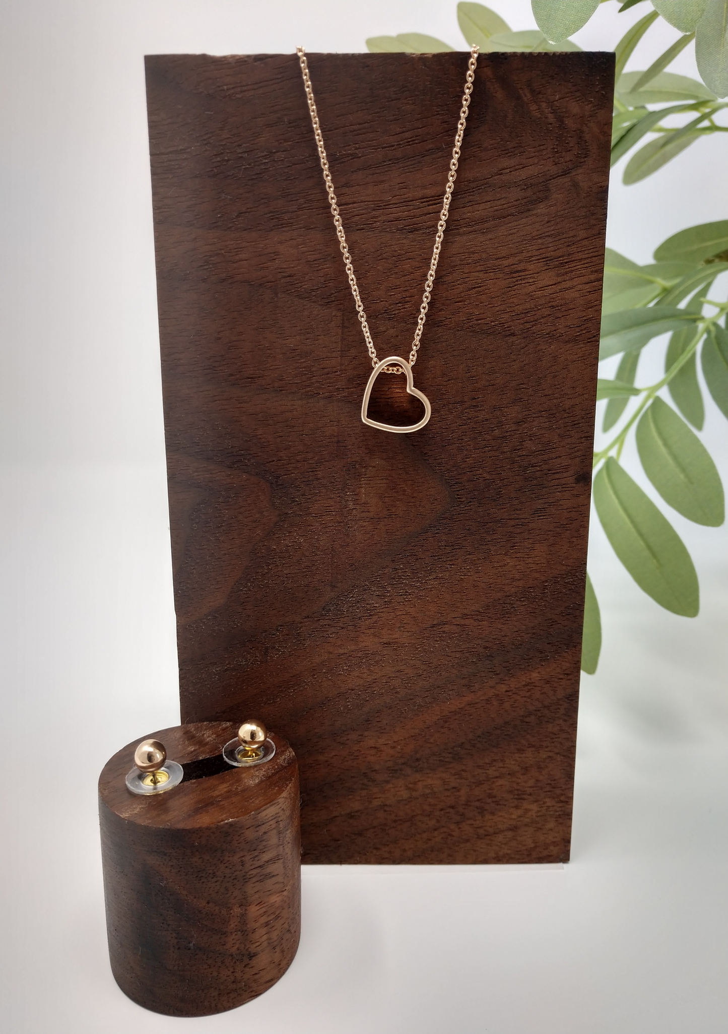Open Heart pendant necklace and earring set.It is a 15" long worn gold tone chain with a 3" extender. The worn gold tone heart pendant measures approximately .5" and has a lobster claw closure. Plus, it comes with cute .25" post style earrings to match.