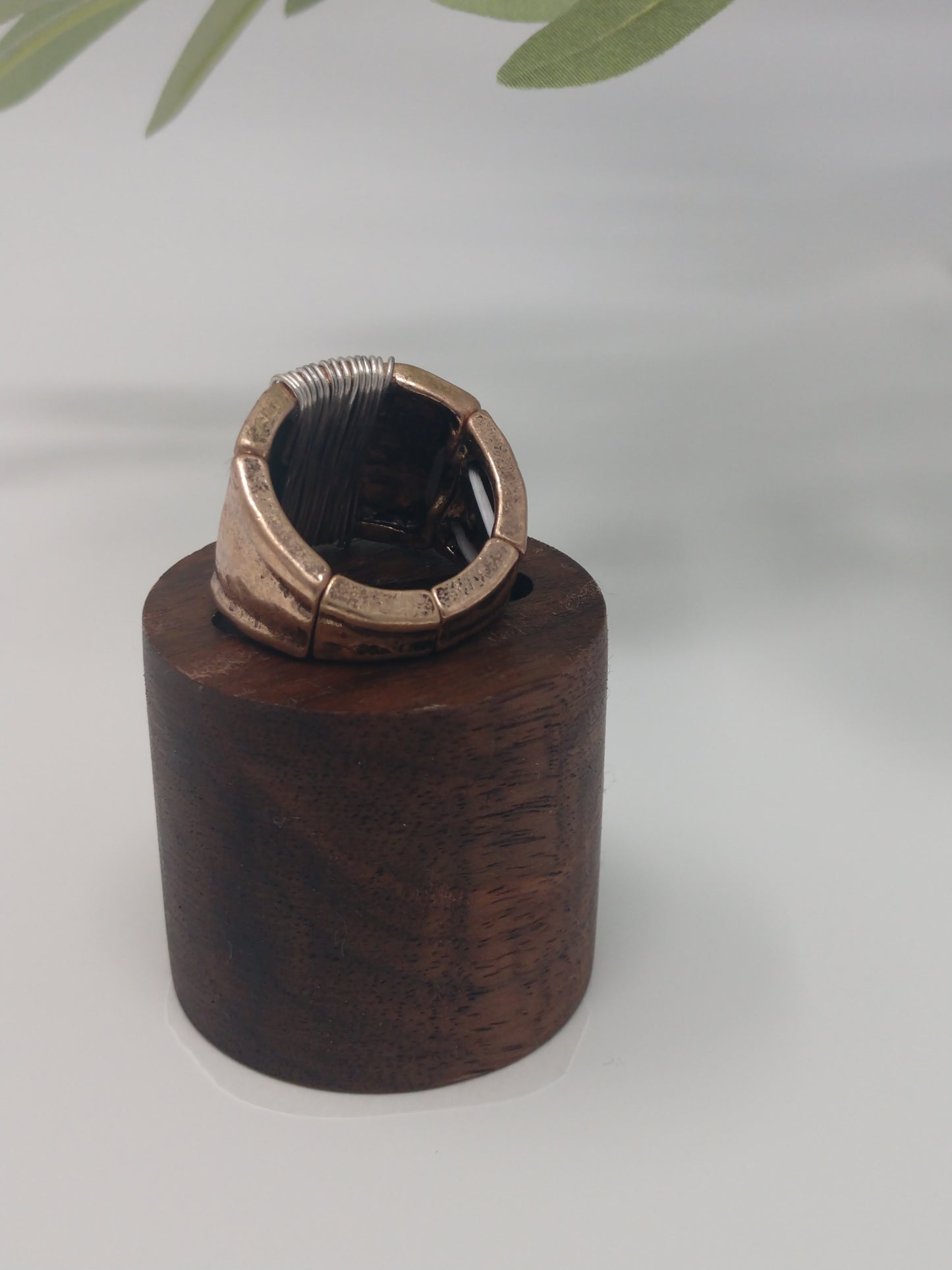 This simple yet stylish ring is a great mix of burnished gold tone with a burnished silver tone wire wrap made with a comfort stretch band. Up to .75" wide. Makes a great addition for your collection or would make a wonderful gift for a friend. No need to worry about their ring size due to the comfort stretch band.
