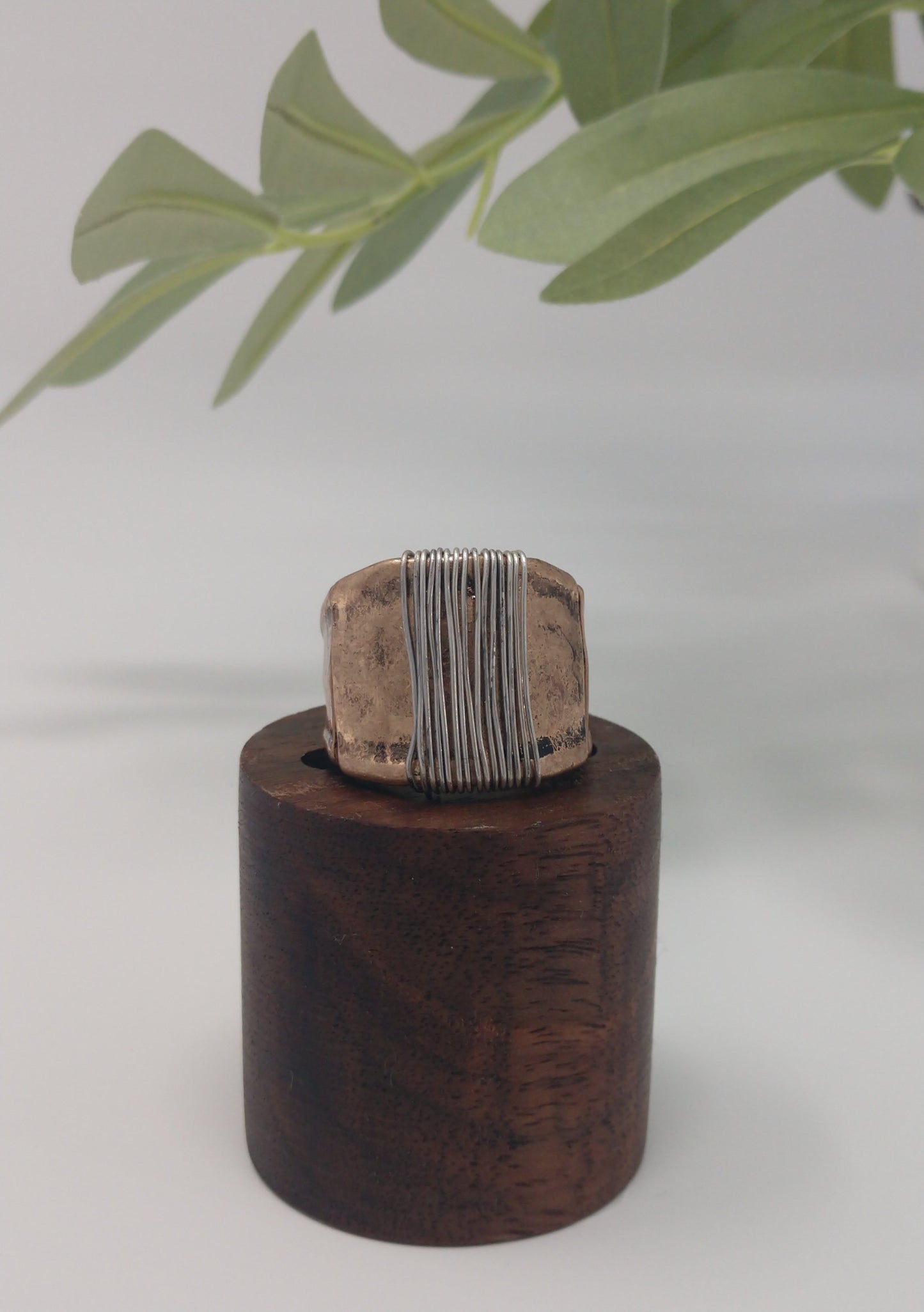 This simple yet stylish ring is a great mix of burnished gold tone with a burnished silver tone wire wrap made with a comfort stretch band. Up to .75" wide. Makes a great addition for your collection or would make a wonderful gift for a friend. No need to worry about their ring size due to the comfort stretch band.