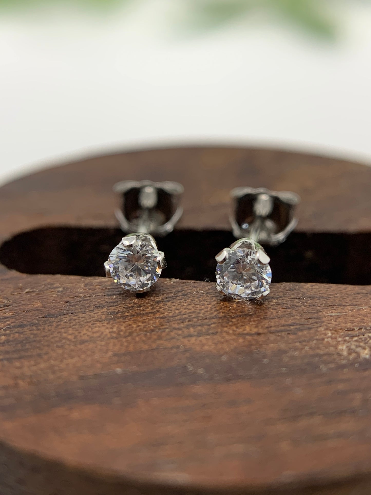 Made of sterling silver and holding a .25ct cubic zirconia stone. They are rhodium plated to prevent tarnishing. Limited Quantity!