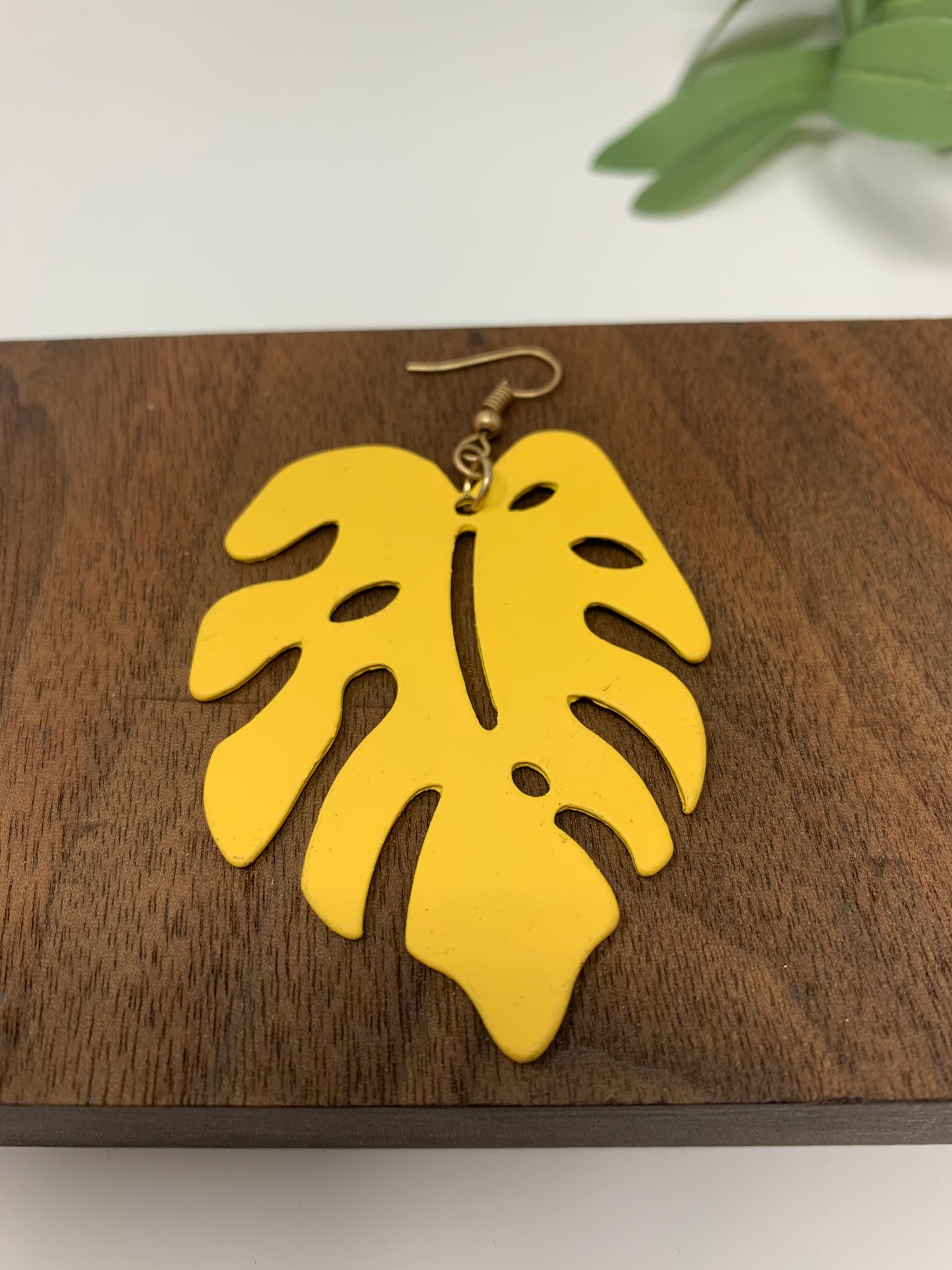 Tropical leaf hook earrings, metal and weigh 1oz each. They are not light weight.