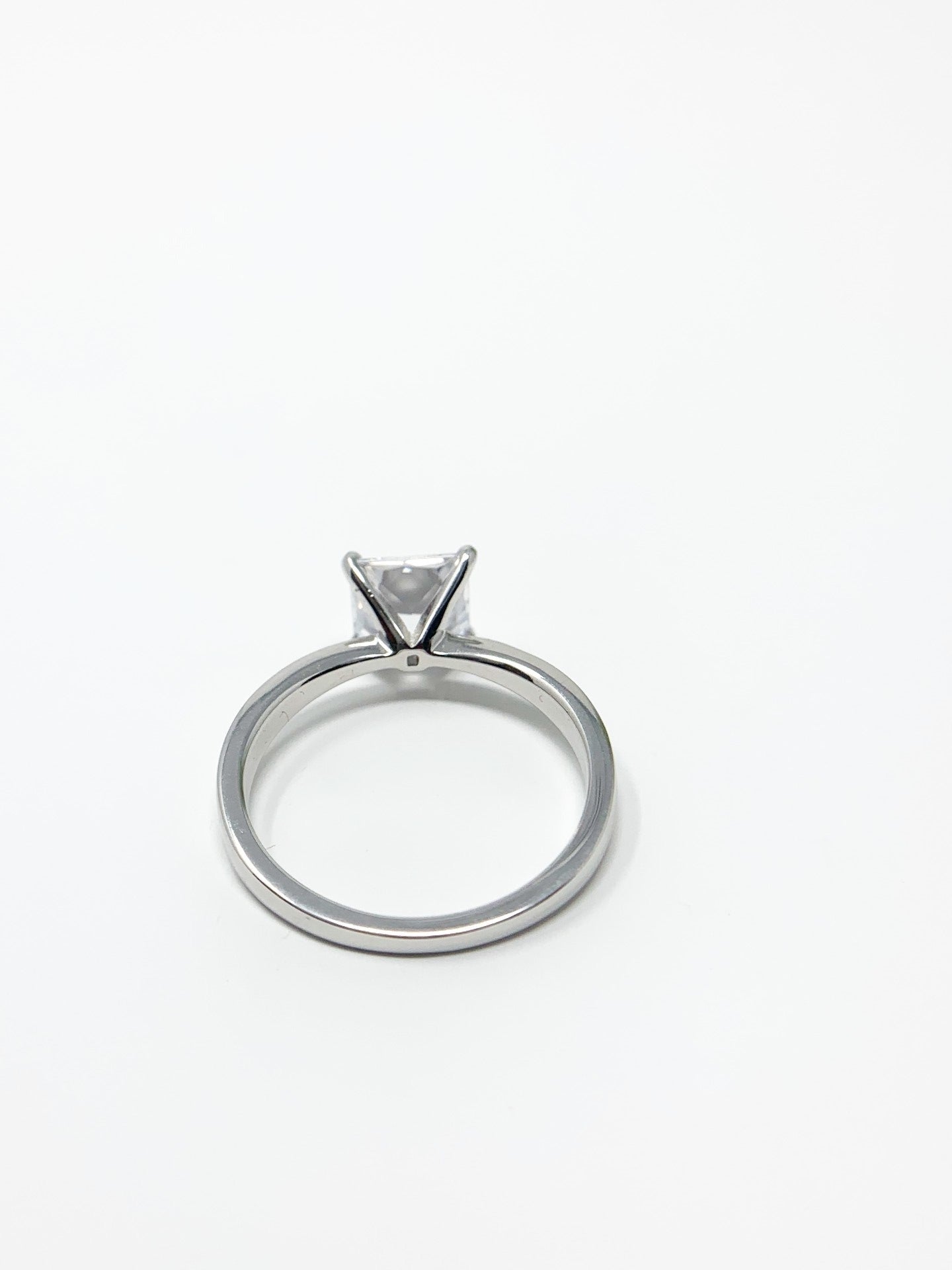 Do you love the classic look of the solitaire princess cut rings? This may be the perfect ring for you! It is gorgeous and offers that classic, timeless charm. Great gift, treat yourself! It is a 1.96ct cubic zirconia set in a high prong on a sterling silver band that is plated in rhodium to prevent tarnishing! Limited Quantity Our rings are in whole sizes only. We do carry ring sizers if you are an in between size.