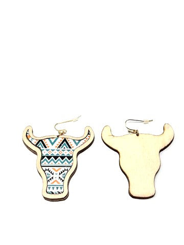 These are cattle head shaped and made of wood. They have a solid wood backing, faux leather, gold tone hardware and fishhook.