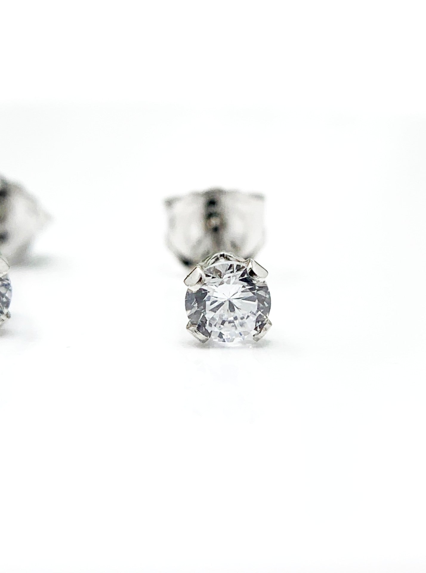 Made of sterling silver and holding a .25ct cubic zirconia stone. They are rhodium plated to prevent tarnishing. Limited Quantity! sterling silver and cz earrings, gift ideas for mom, cz diamond earrings for girlfriend,