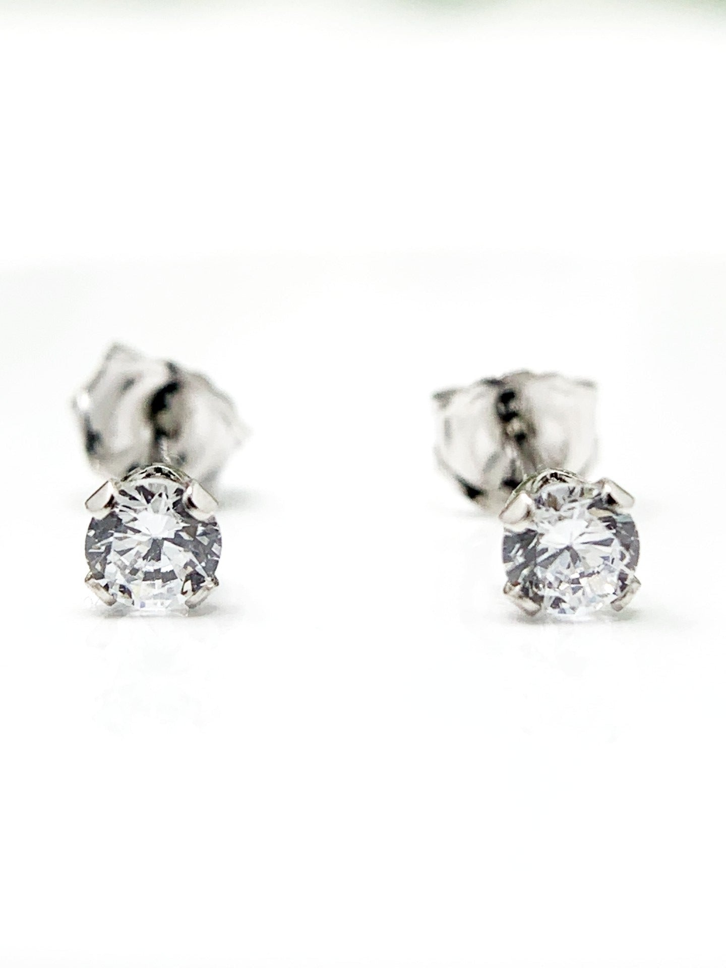 Made of sterling silver and holding a .25ct cubic zirconia stone. They are rhodium plated to prevent tarnishing. Limited Quantity!