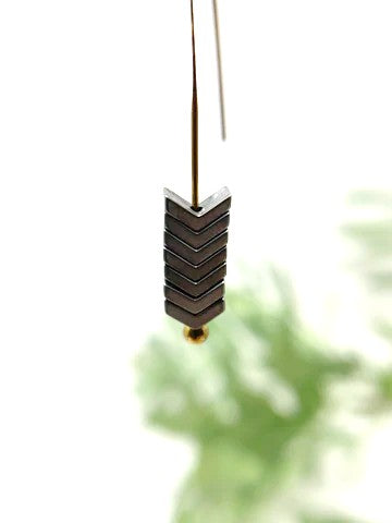 These beauties are made from seven silver tone chevron shapes stacked on a long gold tone french hook earring. They offer a truly unique and sleek look.