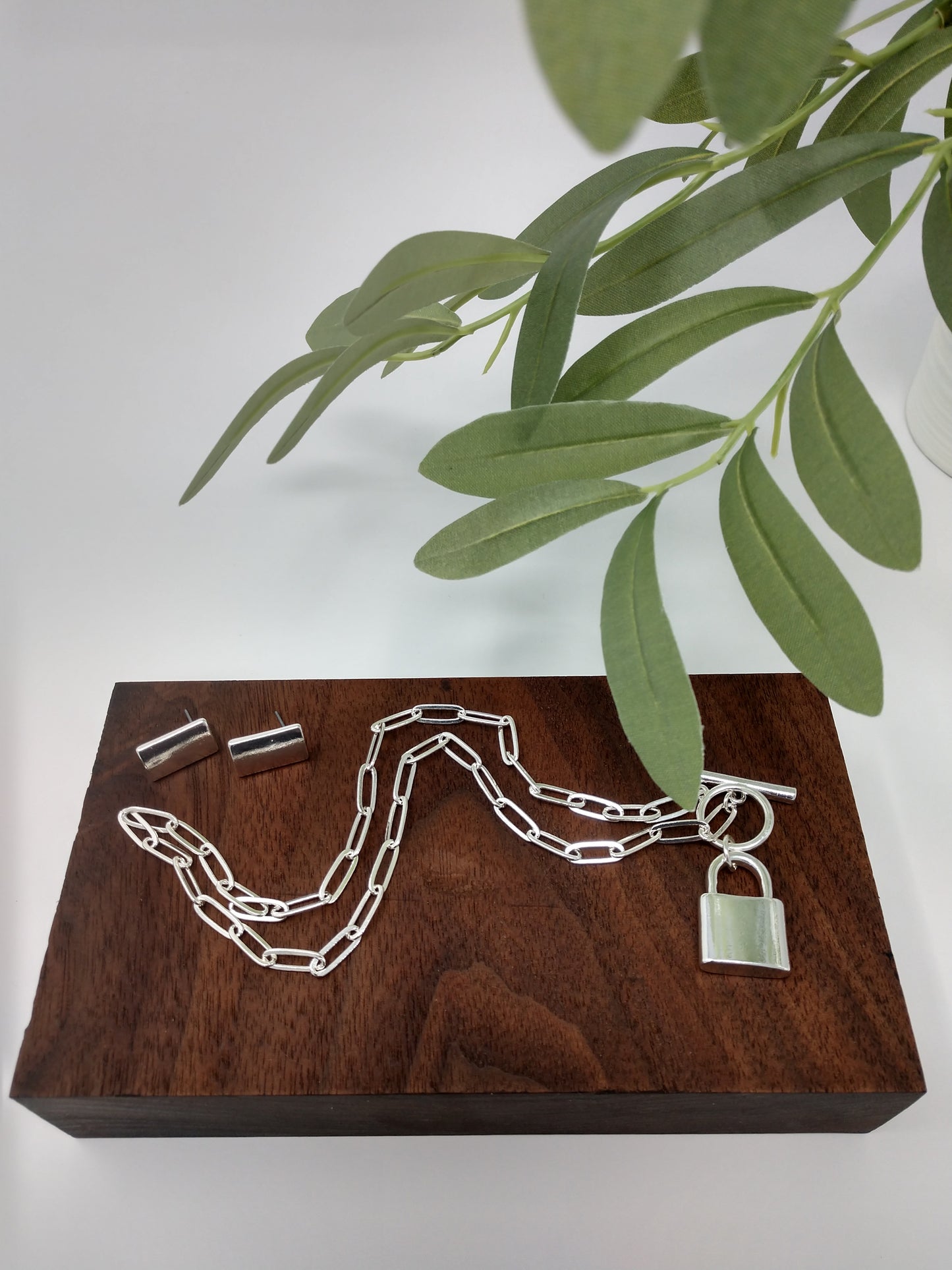 Can be layered for a unique look or worn alone. Great gift ideas for teens or for yourself! This linked chain necklace measures approximately 15.5", with a padlock pendant measuring up to 1" with a toggle closure. Limited Quantity