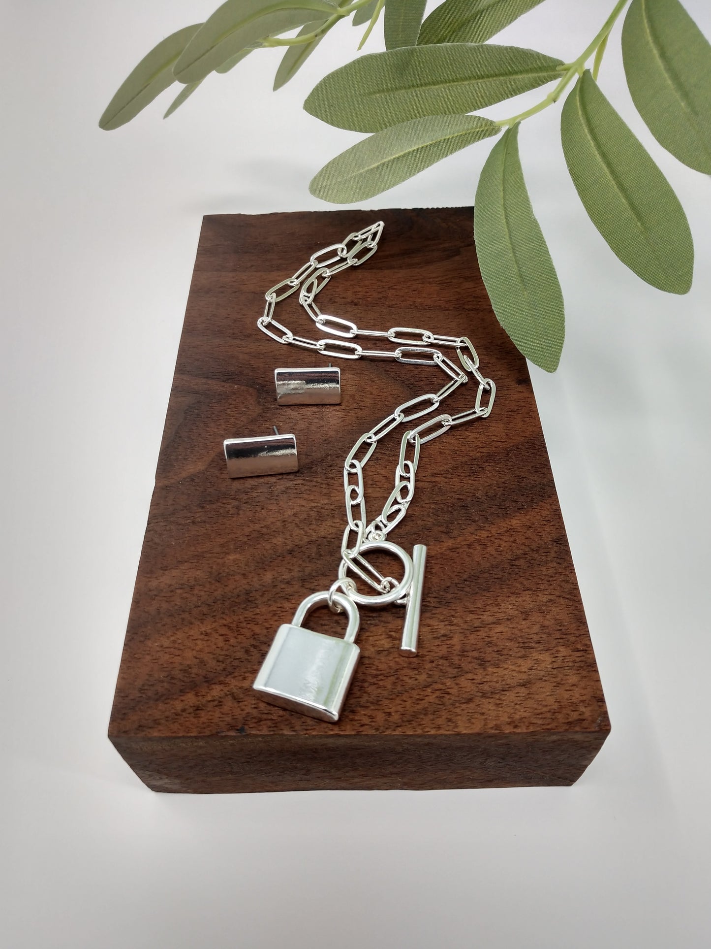 Can be layered for a unique look or worn alone. Great gift ideas for teens or for yourself! This linked chain necklace measures approximately 15.5", with a padlock pendant measuring up to 1" with a toggle closure. Limited Quantity