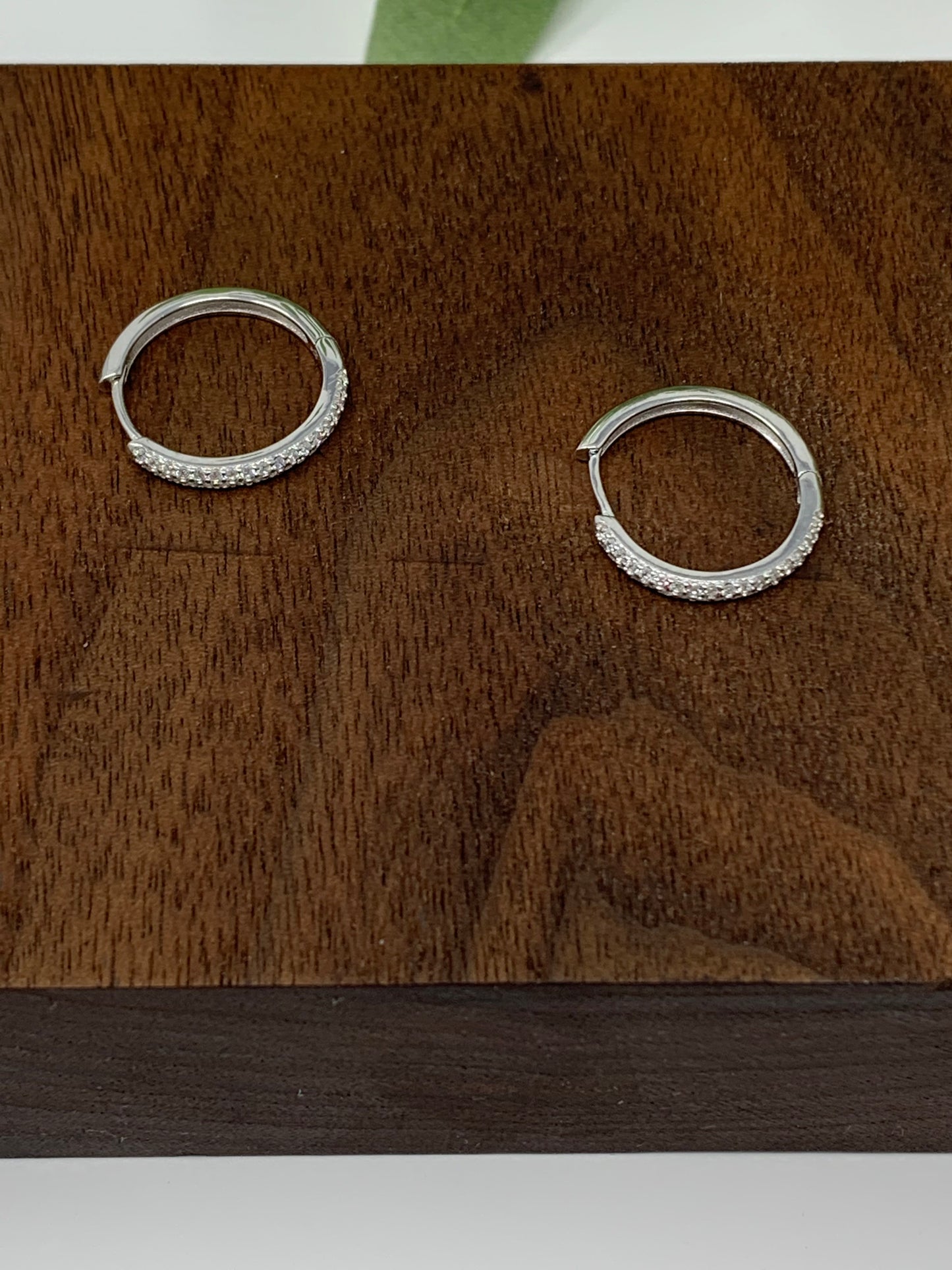 Made from sterling silver with rhodium plated to prevent tarnishing. They are beautifully designed with 34 round cubic zirconia in a prong setting.