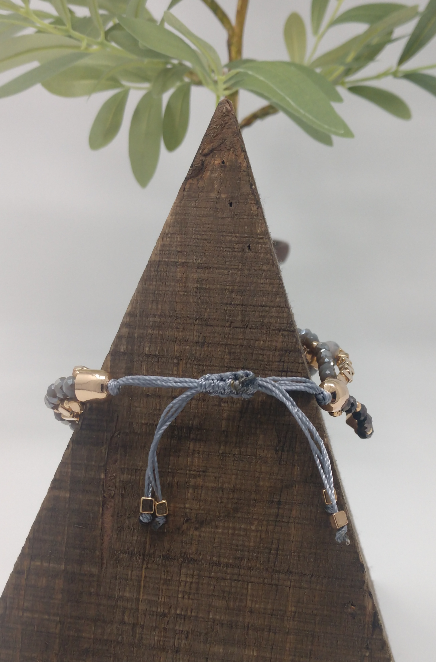 This is a pull adjustable cord bracelet so there is no clasp closure.