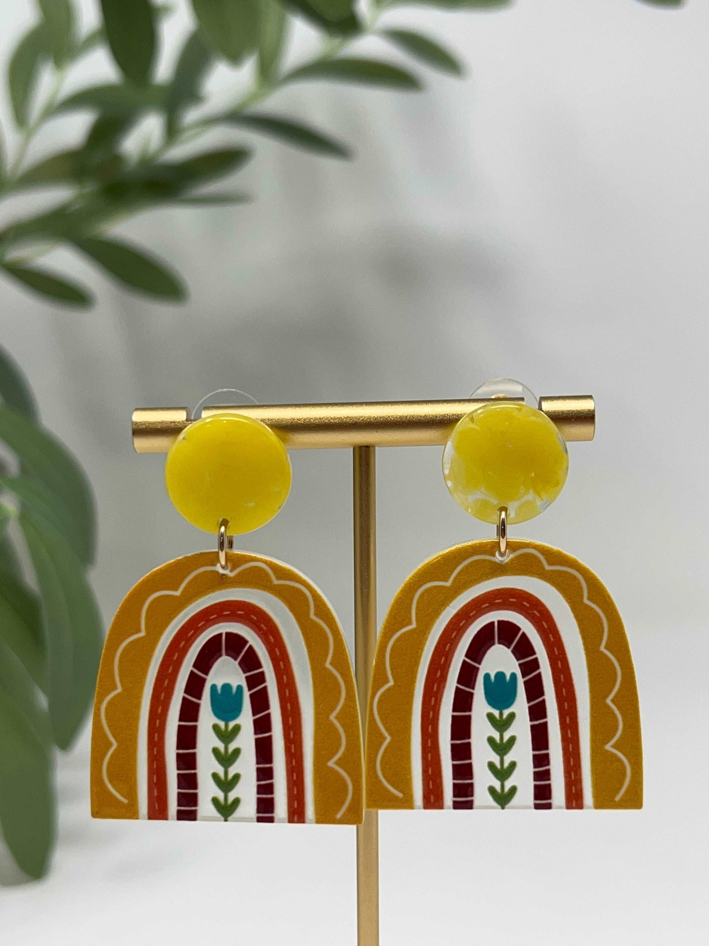 Acrylic Earrings. These beautiful and colorful rainbow earrings are acrylic with a post style backing and gold tone hardware. 
