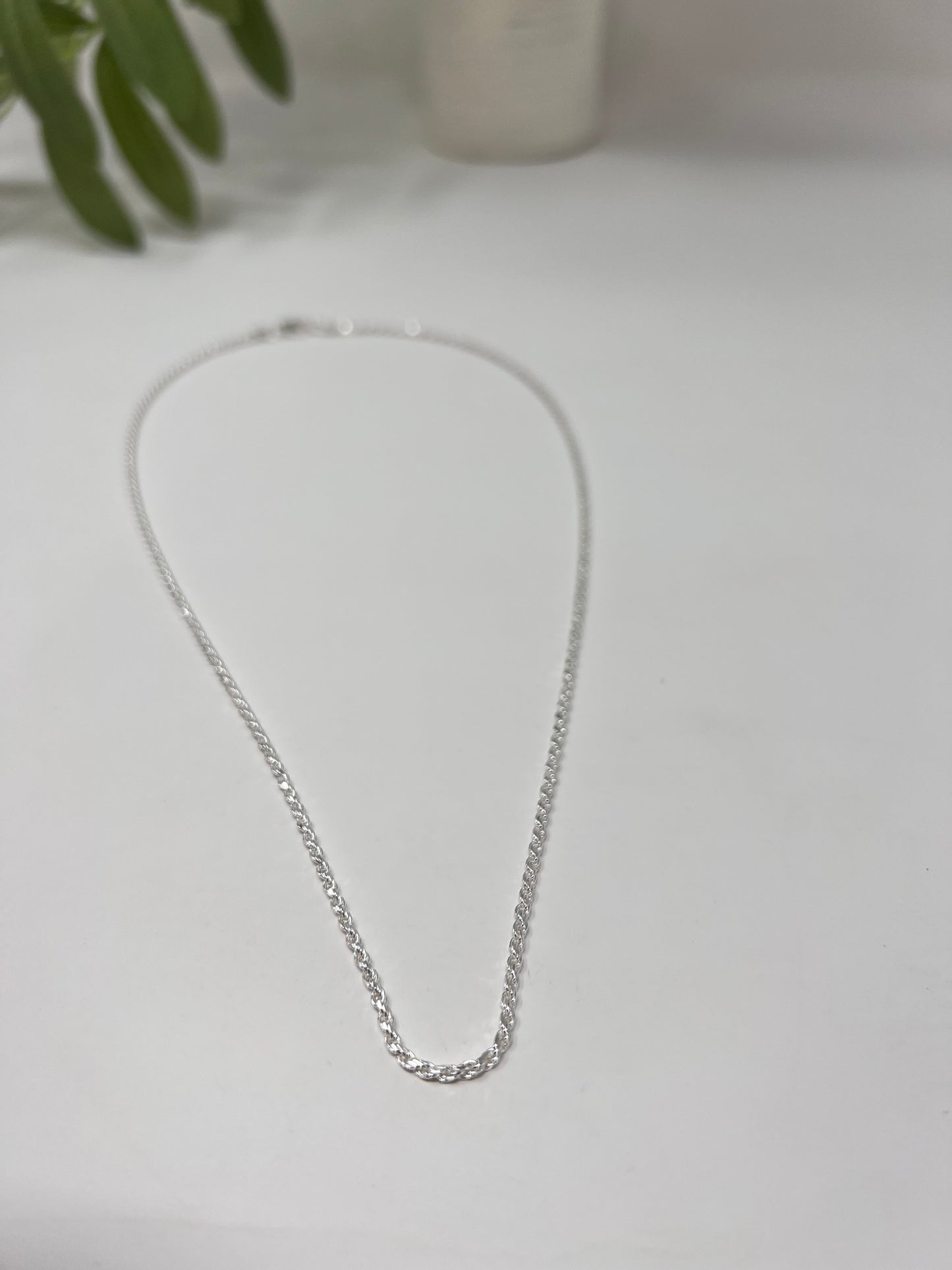 925 sterling silver chain necklace measuring 1.8mm with a lobster claw closure. Made In Italy and high polished, rhodium coated.  